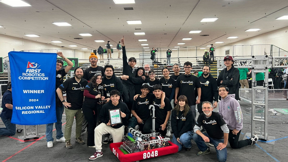 Hope Horizon Churrobots robotics team together at a competition