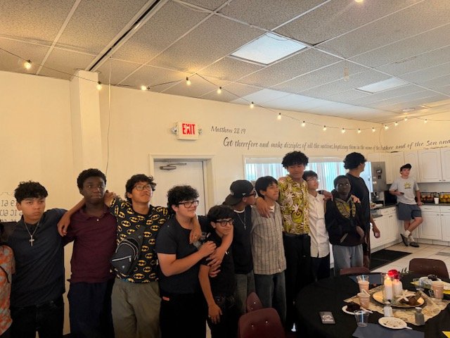 A group of Hope Horizon students together at a community gathering.