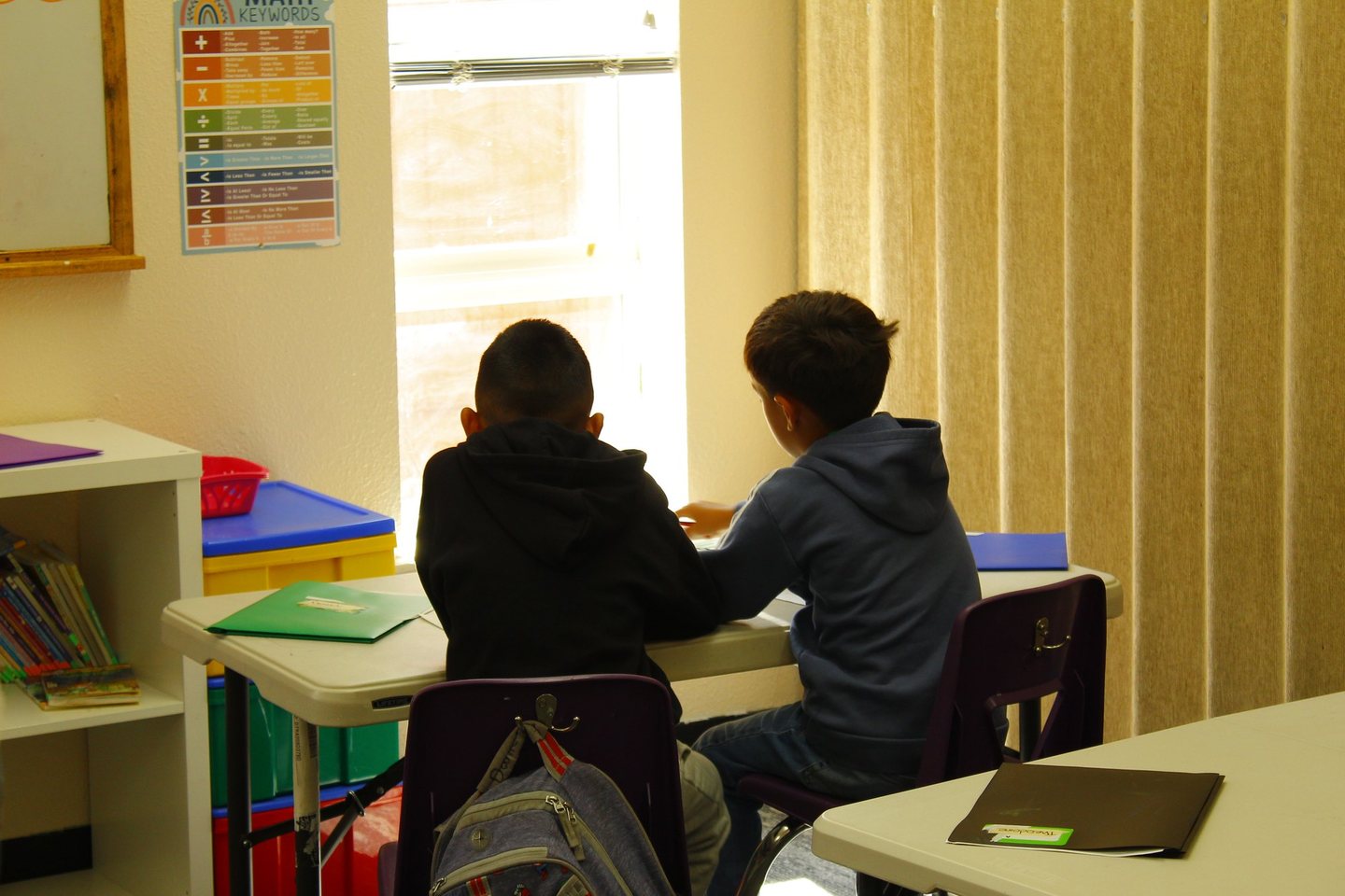 Two Hope Horizon students working together at a desk during afterschool tutoring