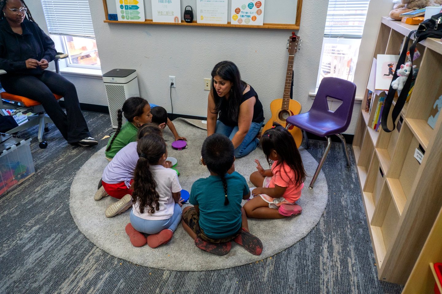 Young Hope Horizon students sitting in a circle with their teacher
