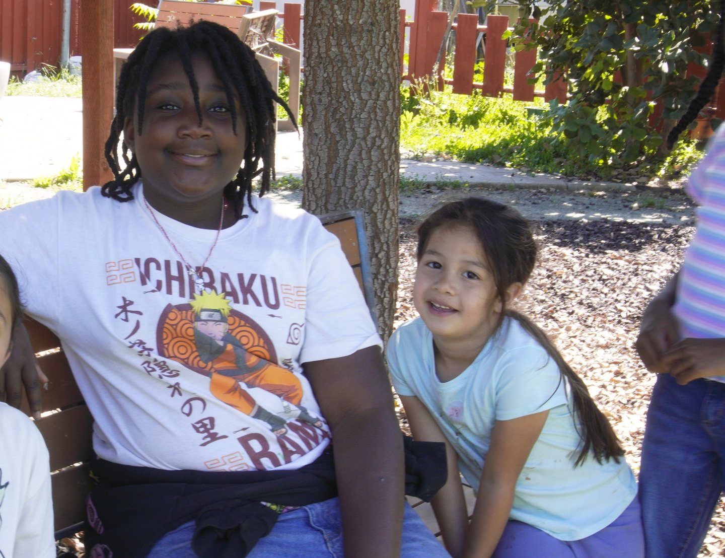 An older Hope Horizon student mentoring a younger one