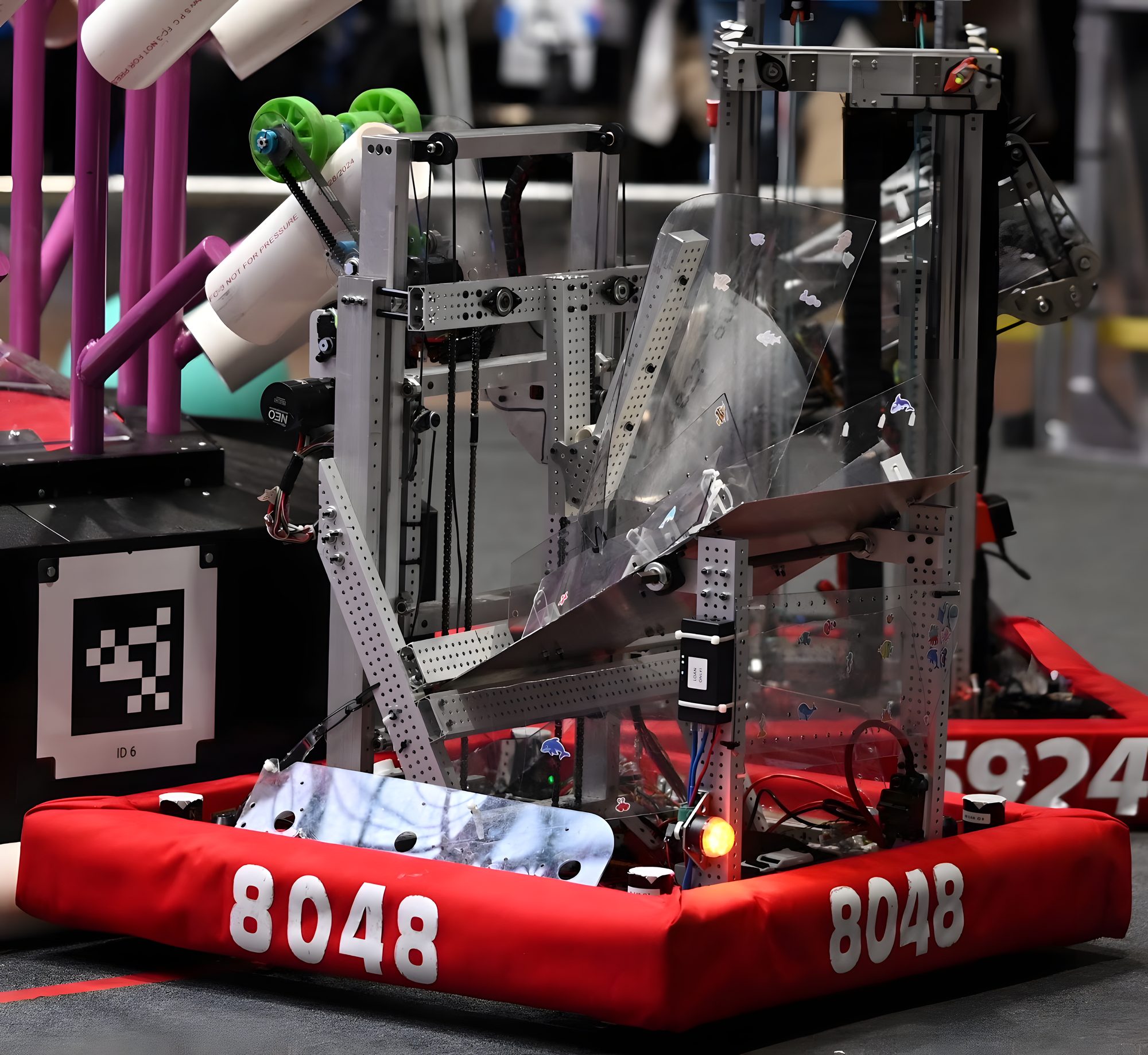 Poseidon, the 2025 robot, with its elevator extended toward the reef