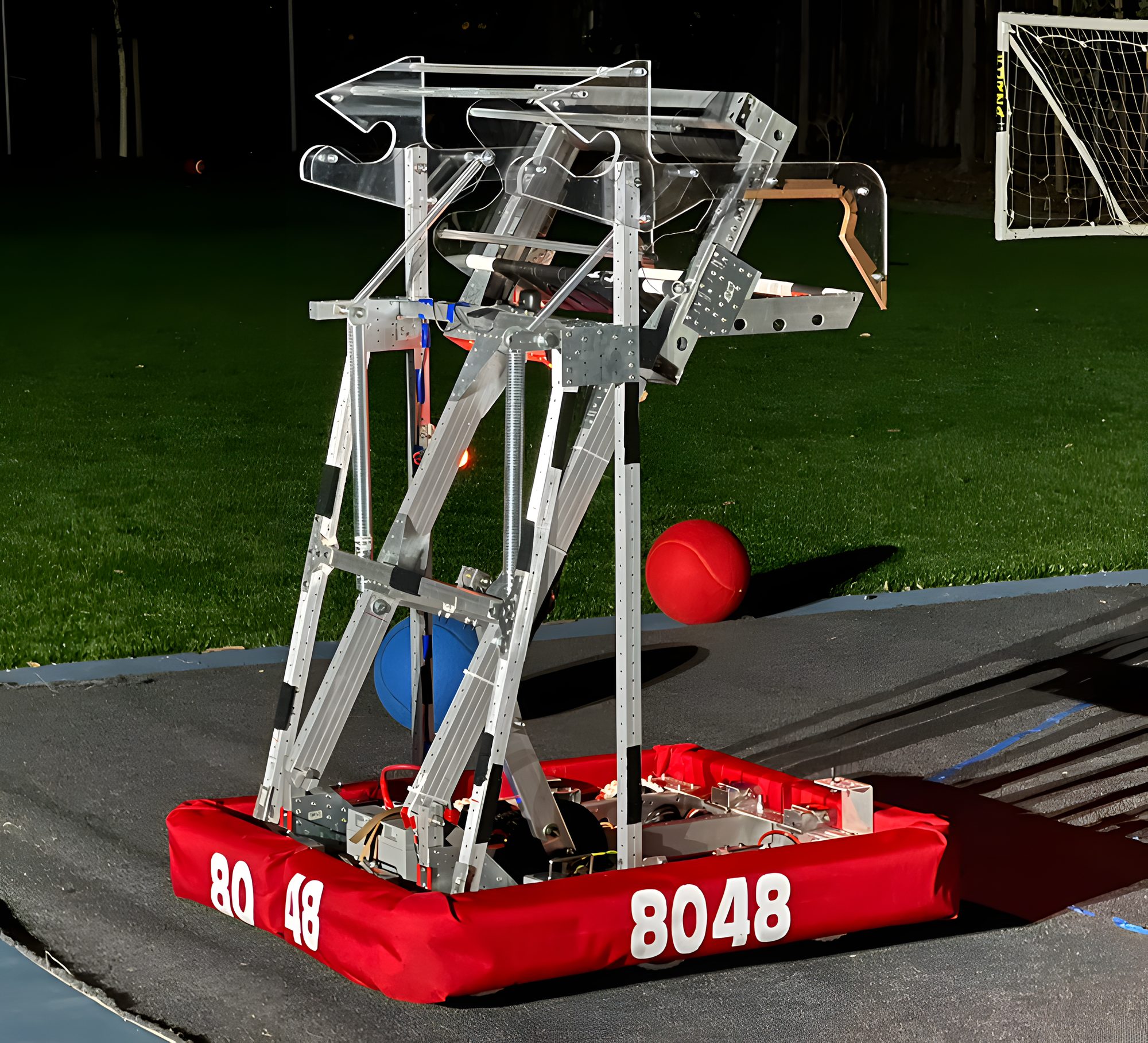 Beefcake, the 2022 robot, climbing the monkey bars on a practice field