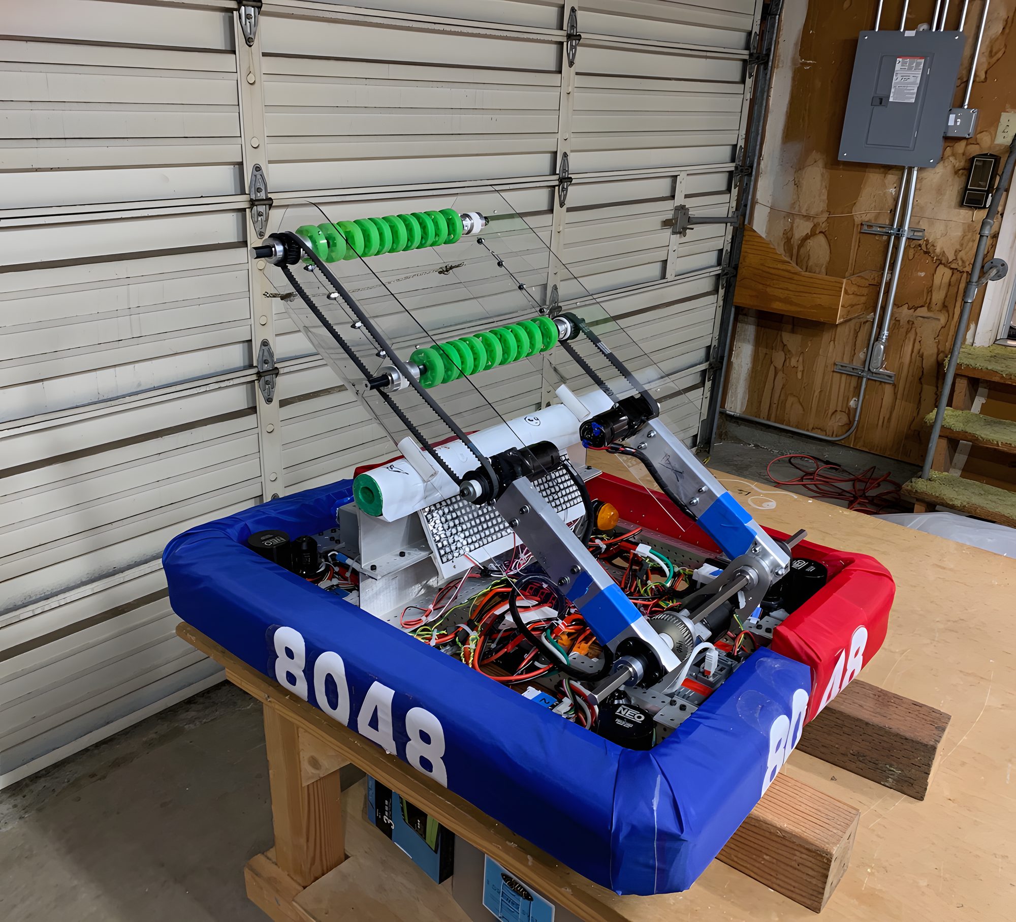Speedy Hedgehog, the 2023 robot, with a green-wheeled drop-down intake and blue bumpers